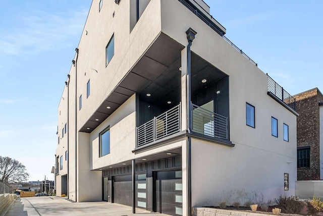 1017 12th Ave S Unit A, Nashville, TN 37203 - view of property featuring a garage and driveway