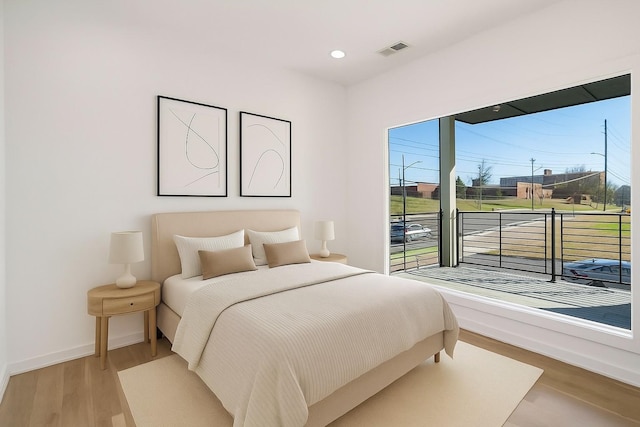 1017 12th Ave S Unit A, Nashville, TN 37203 - bedroom featuring wood finished floors and recessed lighting