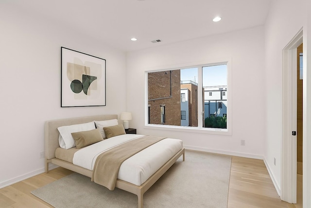 1017 12th Ave S Unit A, Nashville, TN 37203 - bedroom with light wood-type flooring and recessed lighting