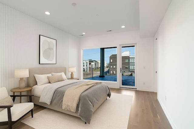 1017 12th Ave S Unit A, Nashville, TN 37203 - bedroom featuring access to outside, wood finished floors, and recessed lighting