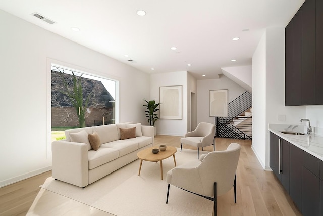 1017 12th Ave S Unit A, Nashville, TN 37203 - living area featuring light wood-style flooring and recessed lighting