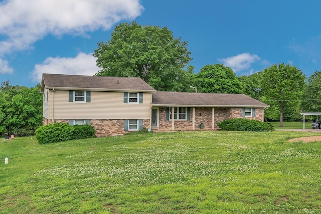 1416 Brannom Dr, Madison, TN 37115 - tri-level home featuring a front lawn and a carport