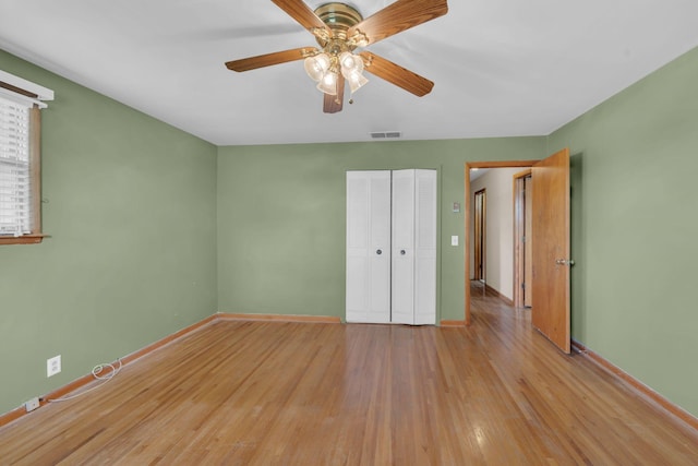 1416 Brannom Dr, Madison, TN 37115 - unfurnished bedroom featuring visible vents, a closet, baseboards, light wood-style floors, and a ceiling fan