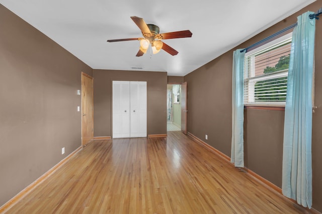 1416 Brannom Dr, Madison, TN 37115 - unfurnished bedroom featuring ceiling fan, visible vents, light wood-type flooring, baseboards, and a closet