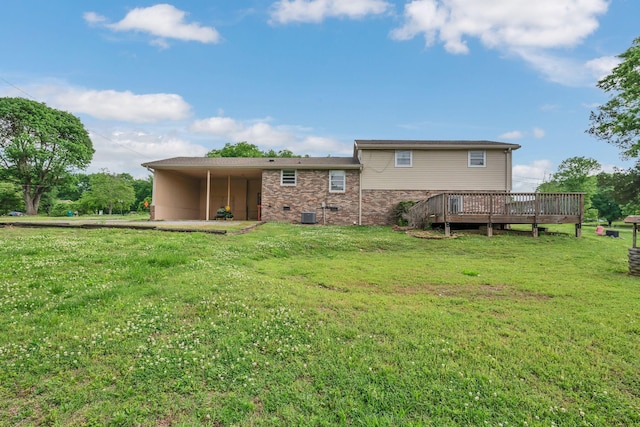 1416 Brannom Dr, Madison, TN 37115 - rear view of house featuring a lawn, a wooden deck, an attached carport, and cooling unit