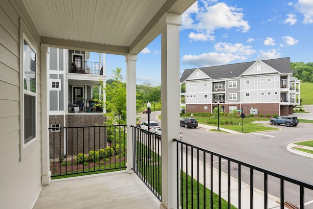balcony featuring a residential view and a porch