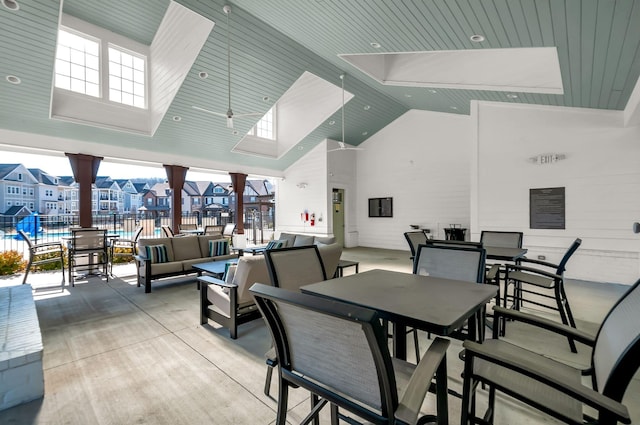 view of patio / terrace with fence, outdoor dining space, outdoor lounge area, and a residential view