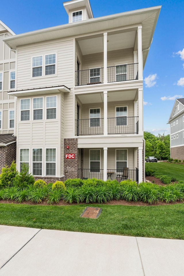view of front of home with a balcony