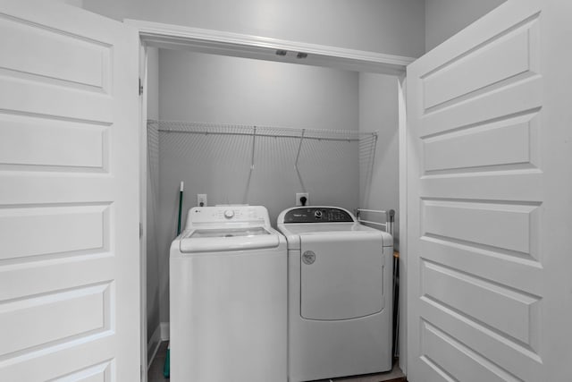 laundry area featuring laundry area and washing machine and clothes dryer