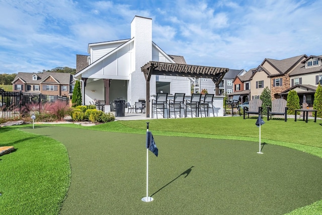 surrounding community with a residential view, fence, a patio, and a lawn