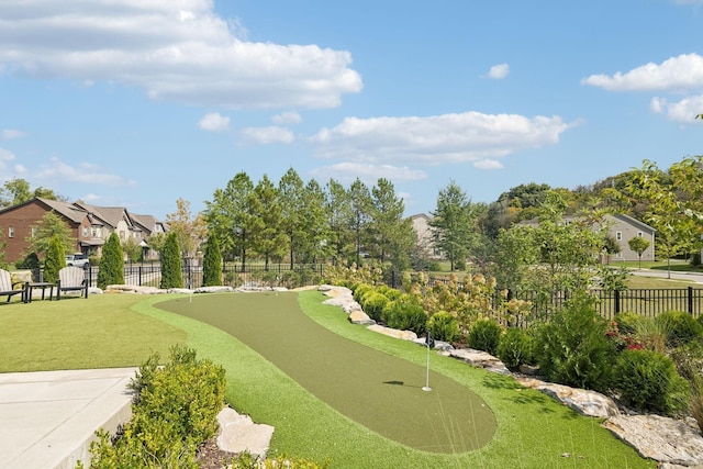 view of property's community with fence and a residential view