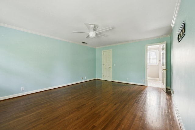 spare room with crown molding, baseboards, a ceiling fan, and dark wood-style flooring