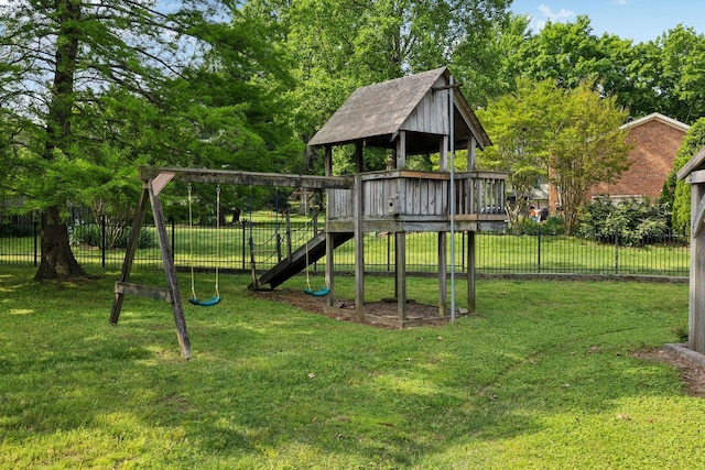 view of play area featuring fence and a yard