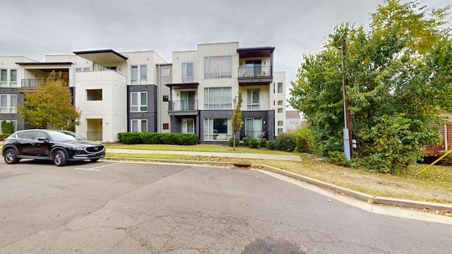 view of property with uncovered parking