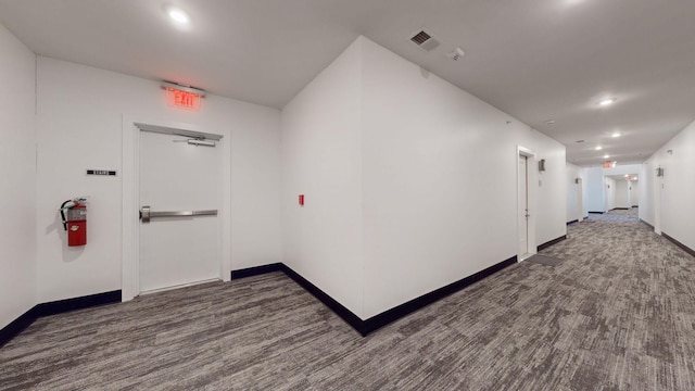 corridor featuring baseboards, recessed lighting, and visible vents