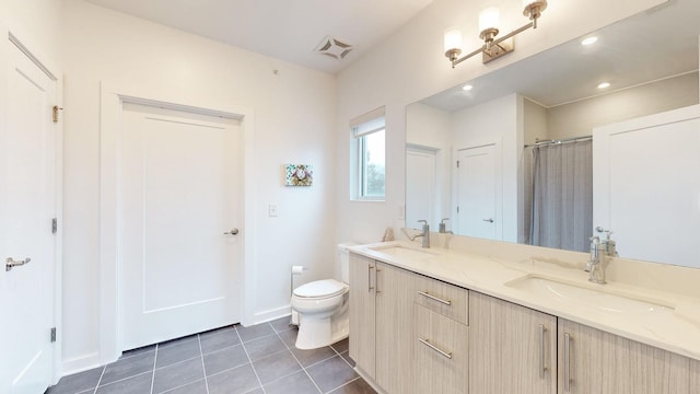 bathroom featuring a sink, tile patterned flooring, toilet, and visible vents