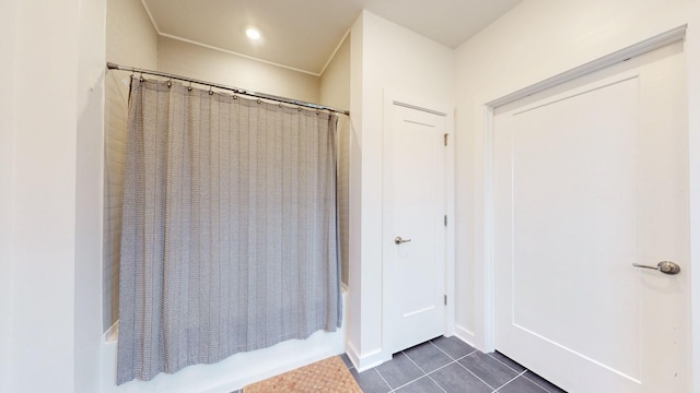 full bathroom featuring tile patterned floors and shower / tub combo