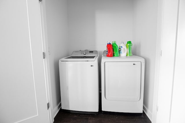 3116 W End Cir Unit 310, Nashville, TN 37203 - washroom with washer and clothes dryer, dark wood-style flooring, and baseboards