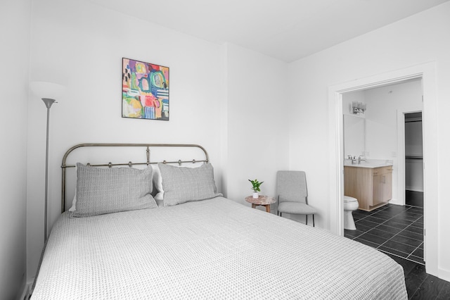 3116 W End Cir Unit 310, Nashville, TN 37203 - bedroom featuring connected bathroom and a sink