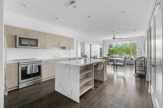 3116 W End Cir Unit 310, Nashville, TN 37203 - kitchen with appliances with stainless steel finishes, modern cabinets, open shelves, light brown cabinets, and recessed lighting