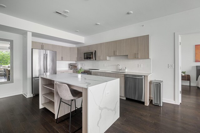 3116 W End Cir Unit 310, Nashville, TN 37203 - kitchen with appliances with stainless steel finishes, a sink, open shelves, backsplash, and light stone counters