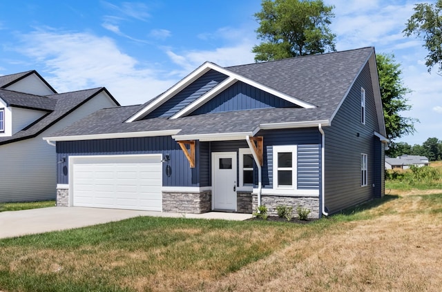 1413 Dan Brown Dr, Clarksville, TN 37042 - view of front facade featuring stone siding, a front yard, a shingled roof, board and batten siding, and an attached garage