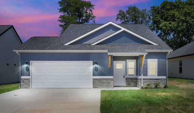1413 Dan Brown Dr, Clarksville, TN 37042 - view of front of house featuring concrete driveway, a shingled roof, and stone siding