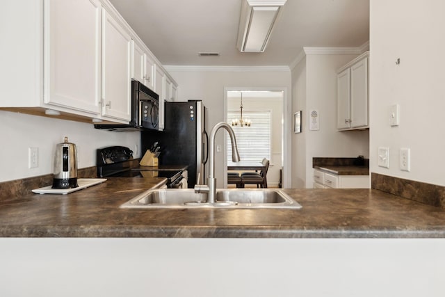 kitchen with crown molding, dark countertops, a sink, black appliances, and white cabinetry