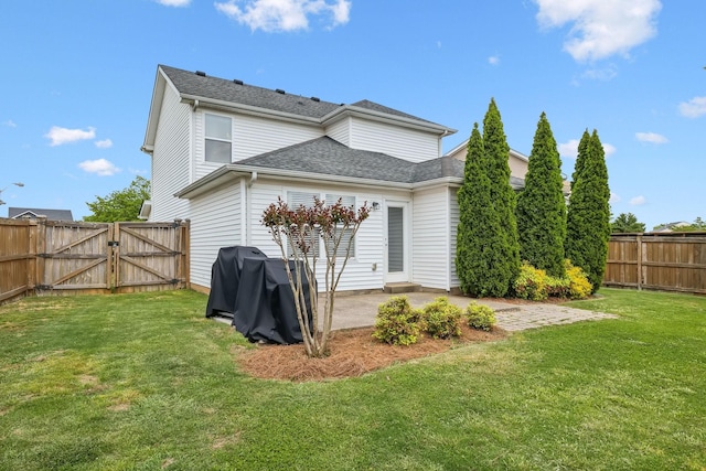 back of property featuring a patio, a fenced backyard, a gate, a shingled roof, and a lawn