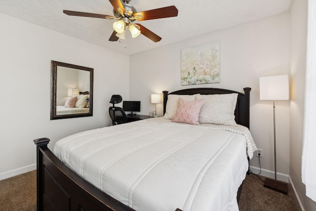 carpeted bedroom featuring baseboards and a ceiling fan