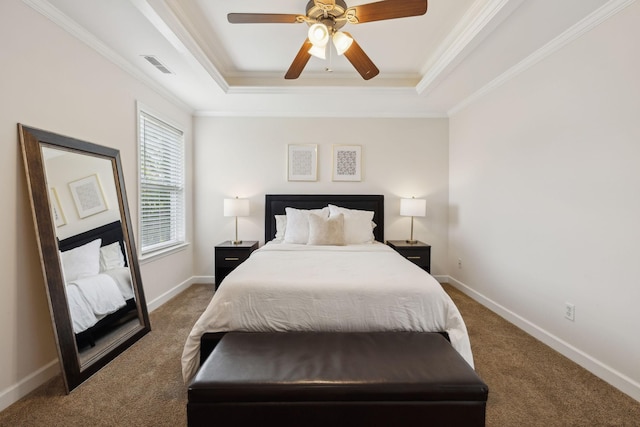 bedroom with crown molding, a raised ceiling, carpet, and visible vents