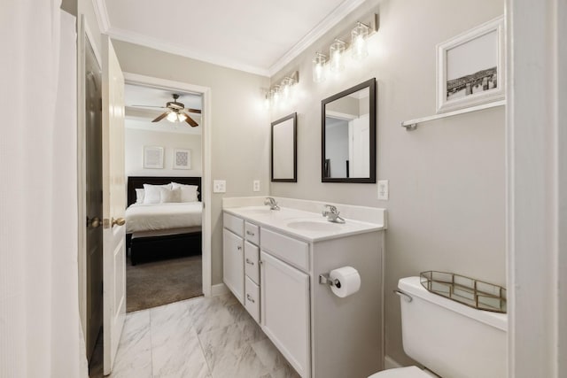 full bathroom featuring a ceiling fan, a sink, toilet, marble finish floor, and ornamental molding