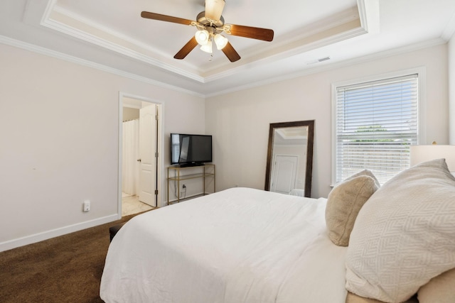 bedroom featuring visible vents, crown molding, baseboards, a tray ceiling, and carpet flooring