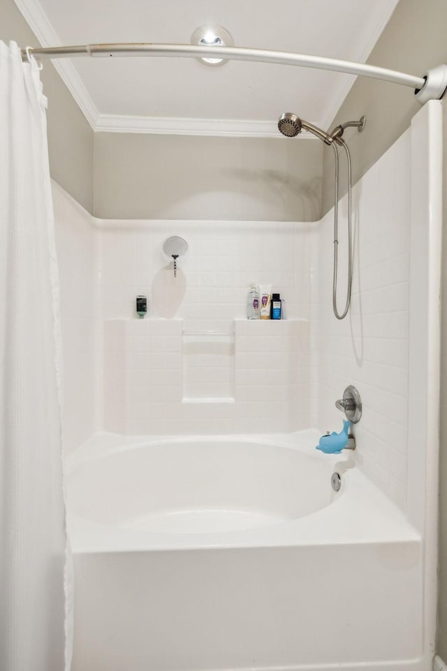 bathroom featuring ornamental molding and shower / tub combo