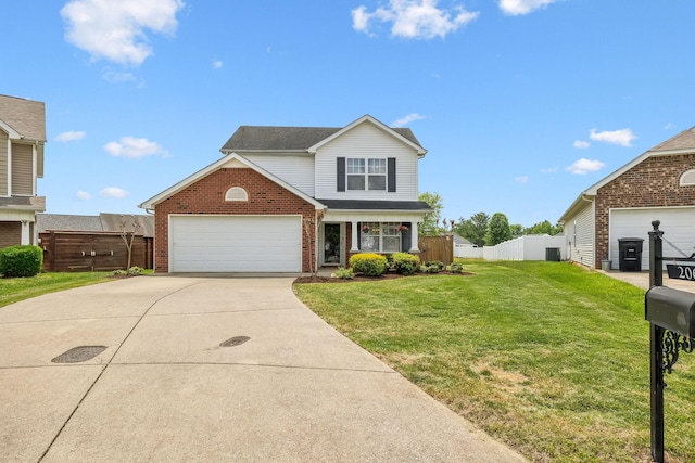 traditional-style house with fence, a front lawn, brick siding, a garage, and concrete driveway