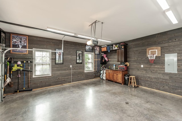 1092 Summerstar Cir, Gallatin, TN 37066 - garage with wooden walls, a garage door opener, and electric panel