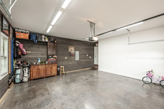 1092 Summerstar Cir, Gallatin, TN 37066 - garage with wooden walls, baseboards, and a garage door opener