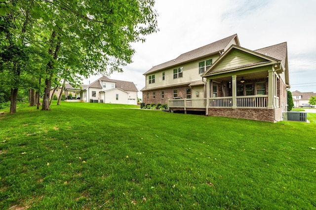 1092 Summerstar Cir, Gallatin, TN 37066 - back of property with a lawn, ceiling fan, and brick siding