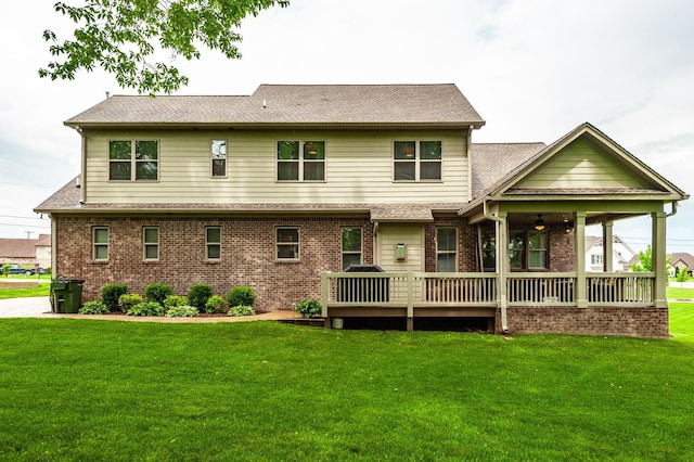 1092 Summerstar Cir, Gallatin, TN 37066 - back of house with a lawn, brick siding, a ceiling fan, and a wooden deck