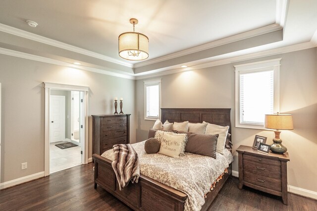 1092 Summerstar Cir, Gallatin, TN 37066 - bedroom with crown molding, baseboards, a tray ceiling, and dark wood-style floors