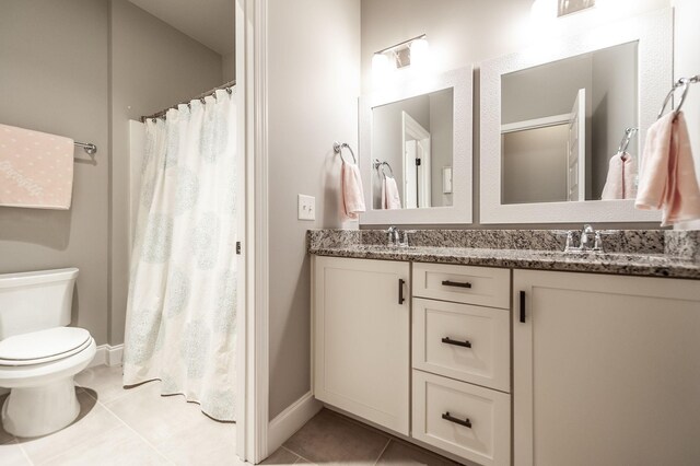 1092 Summerstar Cir, Gallatin, TN 37066 - bathroom with double vanity, tile patterned flooring, a sink, baseboards, and toilet