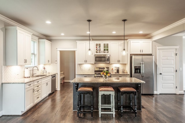 1092 Summerstar Cir, Gallatin, TN 37066 - kitchen featuring a kitchen breakfast bar, dark wood-type flooring, white cabinets, light stone counters, and appliances with stainless steel finishes