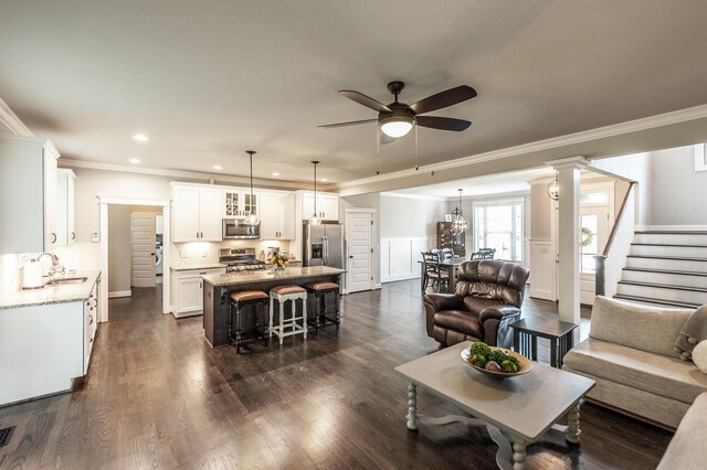 1092 Summerstar Cir, Gallatin, TN 37066 - living area featuring a ceiling fan, recessed lighting, ornamental molding, and stairway