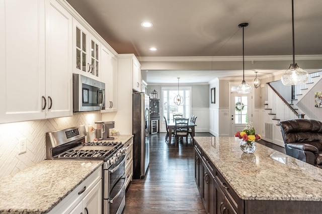 1092 Summerstar Cir, Gallatin, TN 37066 - kitchen with crown molding, stainless steel appliances, white cabinets, and dark wood-type flooring