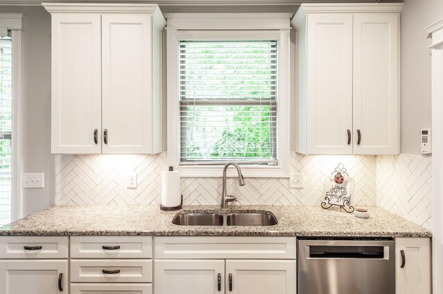 1092 Summerstar Cir, Gallatin, TN 37066 - kitchen with a sink, decorative backsplash, stainless steel dishwasher, and white cabinetry