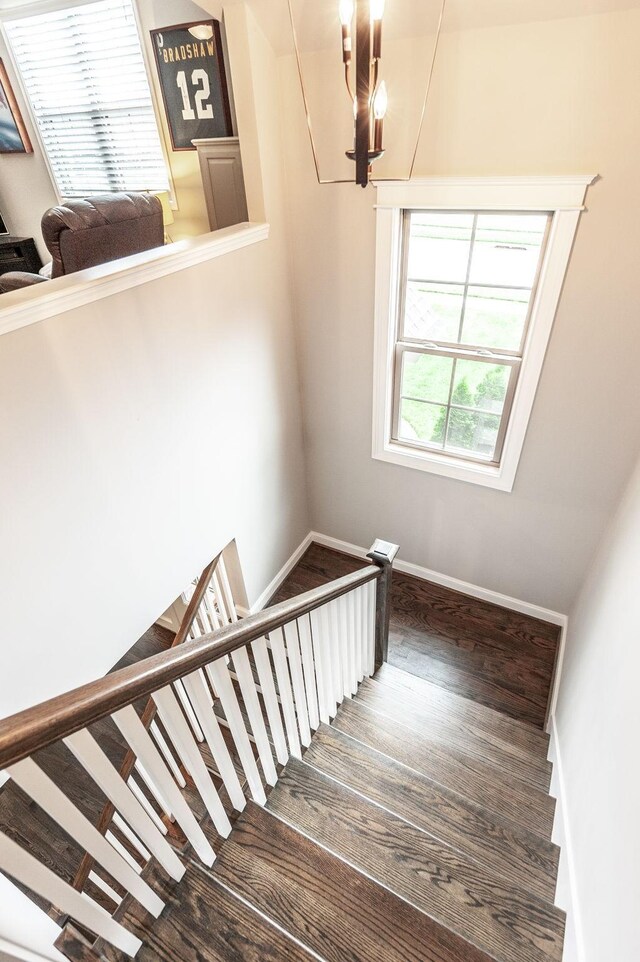 1092 Summerstar Cir, Gallatin, TN 37066 - staircase featuring baseboards, a chandelier, and wood finished floors