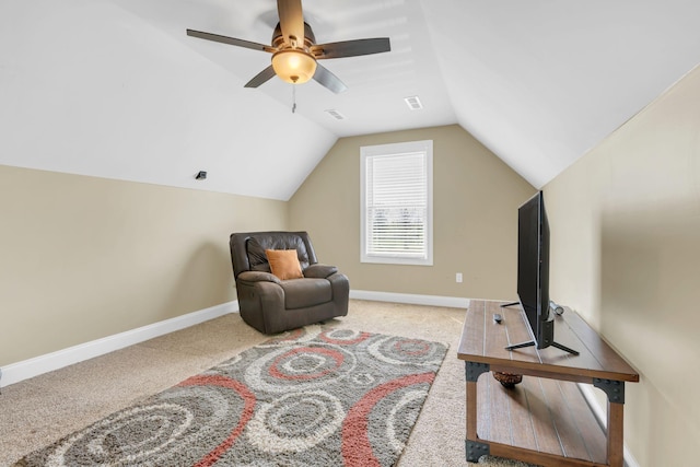 living area with carpet flooring, ceiling fan, baseboards, lofted ceiling, and visible vents
