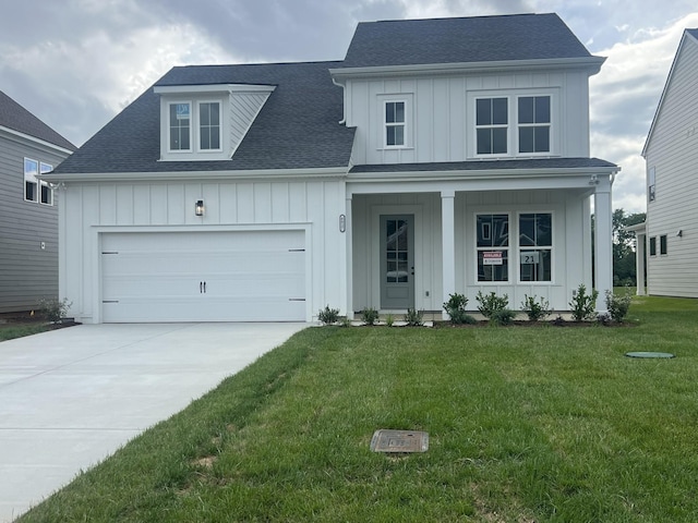 modern inspired farmhouse with board and batten siding, a porch, driveway, roof with shingles, and a front lawn