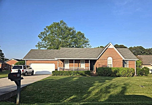 ranch-style house with concrete driveway, brick siding, a front yard, and a garage