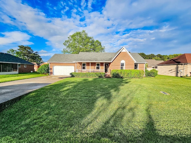 103 Hillcrest Dr, Tullahoma, TN 37388 - ranch-style home featuring brick siding, covered porch, a garage, and concrete driveway